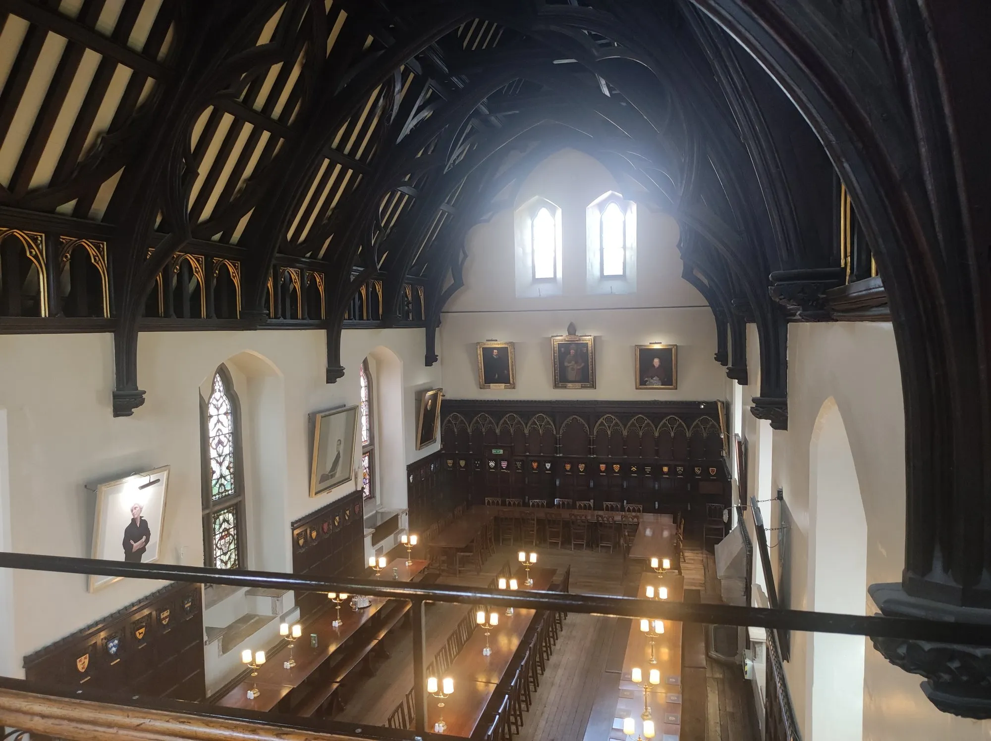 The dining hall of Merton College, Oxford, lined with portraits and long tables